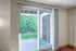 Sliding glass door with access to back patio and storage at Meadow Crest apartments in Vancouver, WA