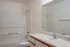 Bathroom with modern features, large mirror and spacious tub at Meadow Crest apartments in Vancouver, WA