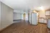 Light-filled and spacious dining and living area with newly renovated flooring at Meadow Crest apartments in Vancouver, WA