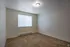 Additional interior photo of bedroom with large, bright window at Meadow Crest apartments in Vancouver, WA