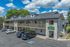 Exterior photo of The Maples apartments with ample parking for residents in Portland, OR