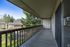 Exterior photo of protected, private patios include with units at The Maples apartments in Portland, OR