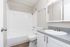Interior bathroom with updated features and tub at The Maples apartments in Portland, OR