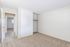 Additional interior photo of bedroom with large closet space inside the 2 bed, 1 bath unit at The Maples
