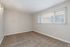 Interior bedroom with large, long window to allow ample natural light inside 1 bed, 1 bath unit at The Maples in Portland, OR
