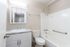 Interior bathroom with modern features and large tub inside one-bedroom unit at The Maples in Portland, Oregon