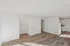 Bright and spacious living area with modern flooring and a clean, open layout perfect for customization.