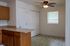 Inviting kitchen area with beautiful wooden cabinetry, ample counter space, and a bright window for natural light.