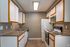 Charming modern kitchen with sleek countertops, stylish cabinetry, and energy-efficient appliances.