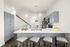 Modern kitchen design with sleek gray cabinetry, elegant pendant lighting, and a spacious island with seating.