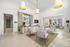 Sophisticated apartment lobby featuring modern seating, elegant decor, and large windows for natural light.