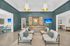 Elegant lounge area with modern seating, stylish wall paneling, and chic pendant lighting, perfect for luxury living.