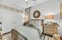 Cozy bedroom featuring elegant decor, plush bedding, modern nightstands, and soft ambient lighting for ultimate relaxation.