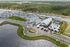 Scenic aerial view of modern residential community with elegant homes, a picturesque pond, and a luxurious swimming pool.