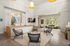 Luxurious apartment interior featuring a spacious and modern seating area, elegant wooden furniture, and ample natural light through large windows.