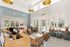 Bright, modern lobby featuring sleek wooden accents, comfortable seating, and large windows inviting natural light.