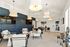 Modern lounge area with elegant lighting, plush seating, and a sleek entertainment setup, ideal for relaxation and social gatherings.