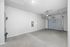 Spacious and modern garage with clean design, featuring a sleek overhead door and high ceilings for versatile storage options.