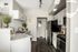 Kithchen with white cabinets, black refrigerator and grey and black stove