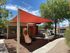 Outdoor playground with shaded cover