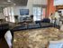 Clubhouse with TV, couches, and tables