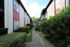 Exterior view of 2 residential buildings with a walking path in the middle