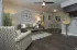 furnished living area with view of kitchen and into bathroom