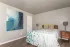 bedroom with bed and wall art