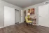 bedroom with desk and chair and view into closet