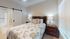 B2 Primary Bedroom at West Hill Apartments in Huntsville, TX