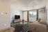 Living room with patio door and tv