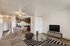 living room with kitchen and tv