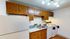 Kitchen with brown cabinets