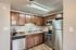 Kitchen with brown cabinets