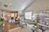 Bright and inviting open-concept living area with elegant decor, featuring a cozy sitting space and modern dining area.