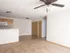 Unfurnished living and dining area at Oak Court Apartments with ceiling fan, plush carpeting, and neutral finishes