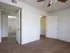 Bedroom view at Willow Creek Apartments showing access to a walk-in closet and private bathroom, ideal for comfortable living.