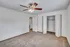 Bedroom featuring ceiling fan, double-door closet, and neutral paint tones.