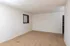 Spacious carpeted bedroom with white walls and natural light at Timbers Apartments near MSU campus.