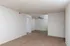 Spacious living and dining area at Timbers Apartments in Springfield, MO, with neutral carpet and ceiling fan for comfortable, functional living.