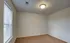 Spacious empty bedroom with neutral paint and carpeting, ready for customization at Embassy Ozark.