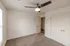 Bedroom with natural light &ndash; Comfortable bedroom at Republic Palms Apartments in Republic, MO, with carpet flooring, a ceiling fan, and a window overlooking the community exterior.