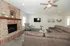 Cozy living room with stylish brick fireplace, modern decor, and comfortable seating for a welcoming ambiance.