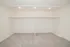 Open bedroom closet area with dual hanging rods, overhead shelving, recessed lighting, and carpeted storage space.