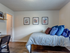Bedroom with desk & plank-style flooring  | Apartment Homes in Lawrence, KS | The Rockland