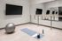 yoga studio with wall to wall mirrors and TV