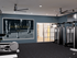 Modern gym facility at Moore's Edge featuring state-of-the-art exercise equipment, stylish design, and motivational wall art.