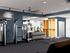 Modern fitness center featuring state-of-the-art weight machines and sleek free weights setup in a spacious, well-lit room.