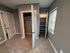 Inviting bedroom with plush carpet, dual closets, and ample natural light from the window.