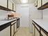 Kitchen with beige and brown countertops at Gladstone Towers apartments for rent in Lansdowne, PA